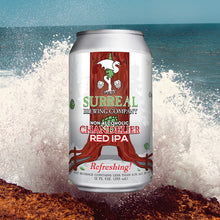 Load image into Gallery viewer, Can of Surreal Non-Alcoholic Chandelier Red IPA with an ocean background.
