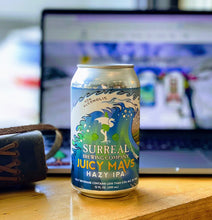 Load image into Gallery viewer, Can of Surreal Non-Alcoholic Juicy Mavs Hazy IPA. 25 calories, zero sugar. Background computer with SurrealBrewing.com website.
